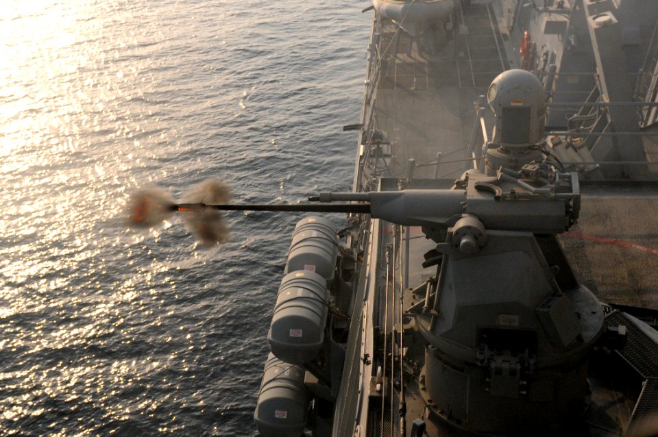 US Navy 110821-N-QL471-929 USS Truxton crew fires the MK 38 during a live-fire exercise