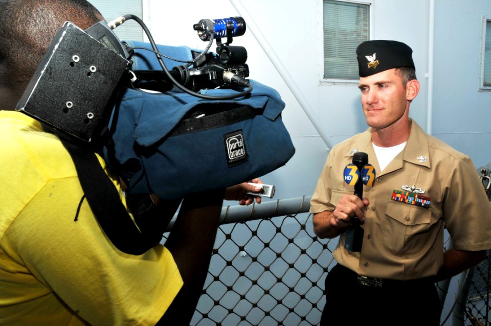 US Navy 110805-N-QY430-082 Fire Controlman 1st Class Joshua Gawdin talks to channel 3 news after a ceremony commemorating the 2,000th combat launch