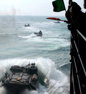 US Navy 110730-N-GH121-081 Marines assigned to the 22nd Marine Expeditionary Unit (22nd MEU) launch amphibious assault vehicles from the amphibious photo