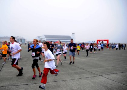 US Navy 110730-N-ZK021-001 Runners participate in a 5K run on the flight line at Naval Air Station Whidbey Island before the start of the Centennia