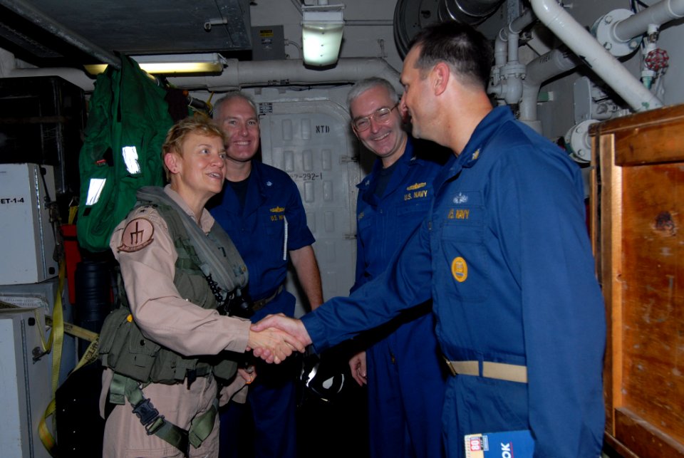 US Navy 110804-N-DU438-156 Rear Adm. Nora W. Tyson, commander of Carrier Strike Group (CSG) 2, is greeted by Command Master Chief Brent Tidwell, r