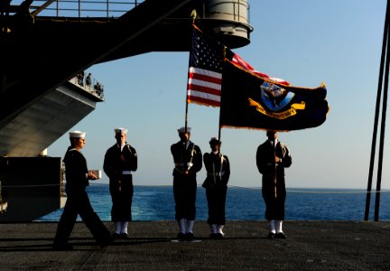 US Navy 110801-N-ZZ999-124 An urn bearer walks past the color guard aboard the Nimitz-class aircraft carrier USS John C. Stennis (CVN 74)