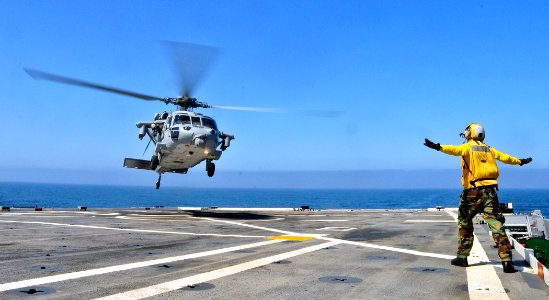 US Navy 110803-N-ZZ999-001 An MH-60S Sea Hawk helicopter with Rear Adm. Gerard Hueber, commander of Expeditionary Strike Group (ESG) 3,