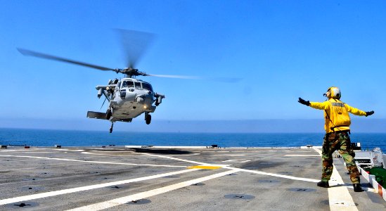 US Navy 110803-N-ZZ999-001 An MH-60S Sea Hawk helicopter with Rear Adm. Gerard Hueber, commander of Expeditionary Strike Group (ESG) 3, photo