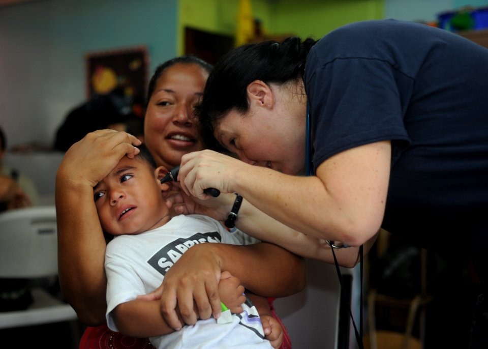 US Navy 110803-N-NY820-108 Cmdr. Laurie Hale examines a patient at the Escuela Fray Casiano de Madrid medical site in Puntarenas, Costa Rica, durin