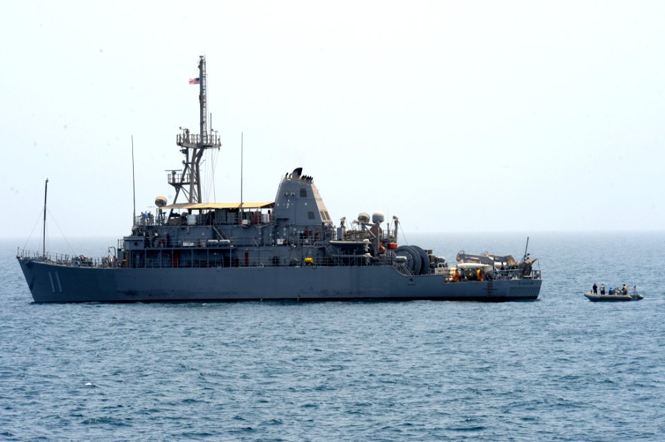 US Navy 110824-N-QL471-302 Sailors in a rigid-hull inflatable boat pull alongside USS Gladiator (MCM 11) to pick up parts