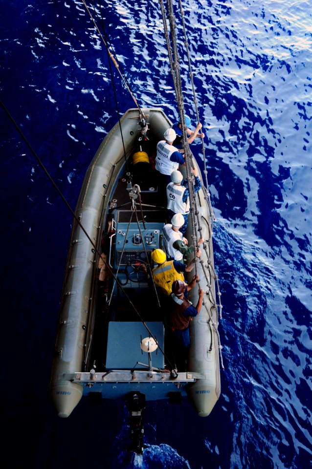 US Navy 110805-N-UO379-089 Sailors assigned to the Ronald Reagan Carrier Strike Group use monkey lines to lower a rigid-hull inflatable boat