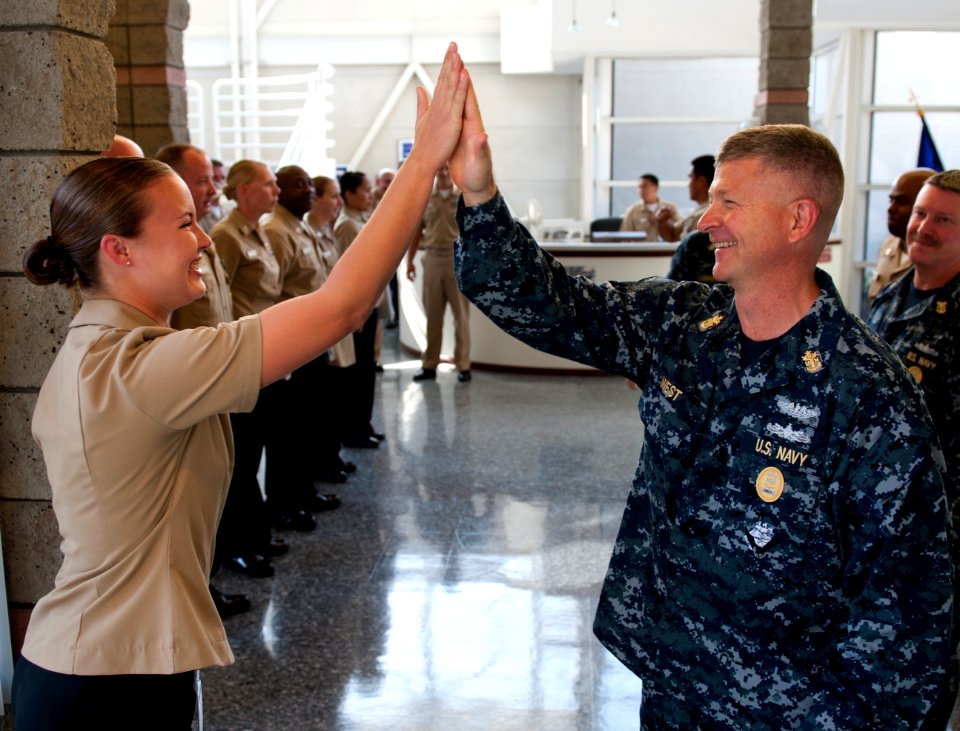 US Navy 110804-N-DR144-456 Master Chief Petty Officer of the Navy (MCPON) Rick D. West high fives Commander, Naval Surface Force U.S. Pacific Fleet