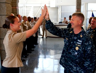 US Navy 110804-N-DR144-456 Master Chief Petty Officer of the Navy (MCPON) Rick D. West high fives Commander, Naval Surface Force U.S. Pacific Fleet photo