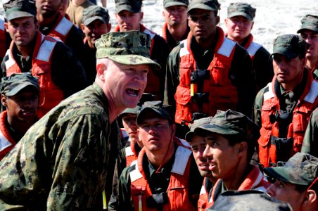US Navy 110805-N-JR159-308 Master Chief Petty Officer of the Navy (MCPON) Rick D. West, center, participates in surf passage at Naval Amphibious Ba