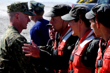 US Navy 110805-N-JR159-250 Master Chief Petty Officer of the Navy (MCPON) Rick D. West, left, congratulates students in Basic Underwater Demolition