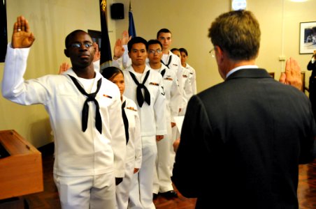 US Navy 110808-N-WW409-092 Sailors recite the oath of citizenship during a naturalization ceremony at the Joint United States Military Advisory Gro
