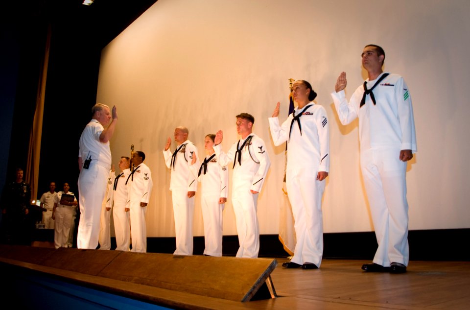 US Navy 110804-N-ZB612-134 Chief of Naval Operations (CNO) Adm. Gary Roughead reenlists eight Sailors during an all-hands call at Naval Air Station