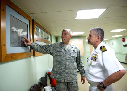 US Navy 110810-N-RM525-245 Capt. Andrew Bouchard, from Novato, Calif., gives Costa Rican Coast Guard officials a tour aboard the Military Sealift C photo
