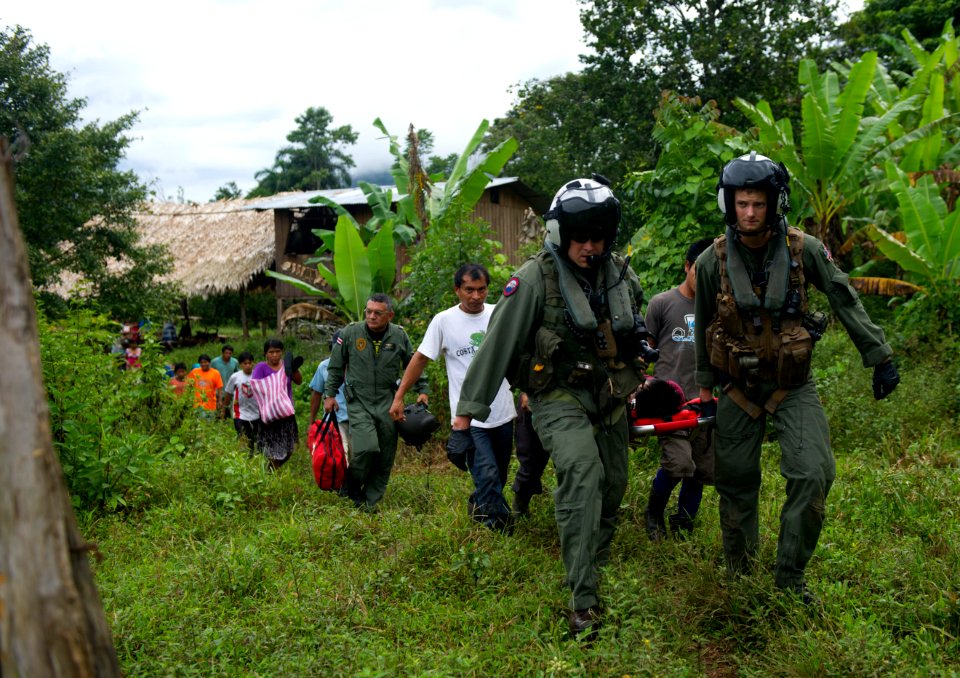 US Navy 110810-N-RM525-588 Chief Naval Air Crewman Justin Crowe, left, Naval Air Crewman 3rd Class Joe Wainscott and villagers from Bajo Blay, Cost