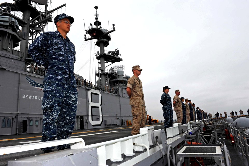 US Navy 110810-N-DX615-085 Sailors and Marines man the rails aboard USS Makin Island (LHD 8)