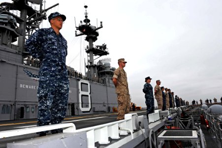 US Navy 110810-N-DX615-085 Sailors and Marines man the rails aboard USS Makin Island (LHD 8)