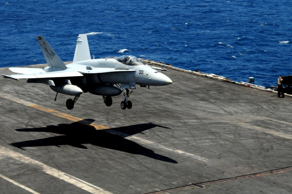 US Navy 110810-N-NB544-063 An F-A-18C Hornet assigned to the Blue Diamonds of Strike Fighter Squadron (VFA) 146 lands aboard the aircraft carrier U