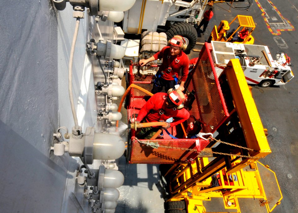 US Navy 110809-N-EE987-204 Sailors clean the island superstructure of USS Ronald Reagan (CVN 76)
