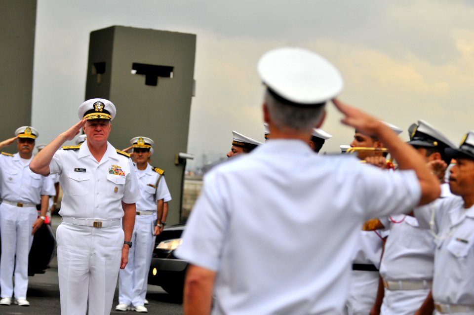 US Navy 110810-N-ZB612-266 Chief of Naval Operations (CNO) Adm. Gary Roughead renders honors during a welcoming ceremony at the First Naval Distric
