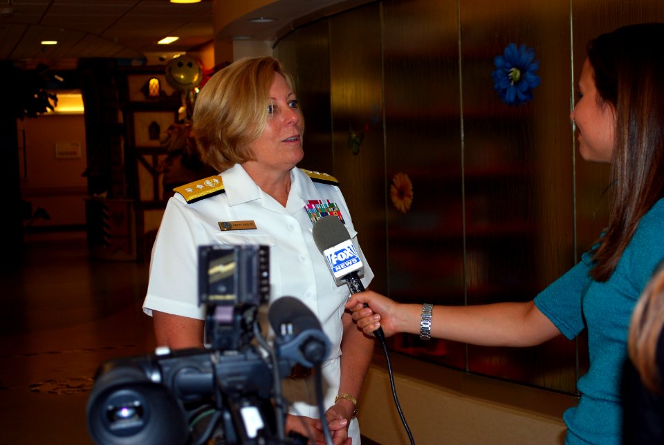US Navy 110809-N-CI293-042 Rear Adm. Patricia E. Wolfe, commander of Navy Expeditionary Logistics Support Group, speaks with a reporter from the lo