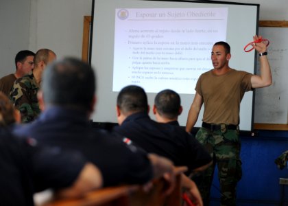 US Navy 110809-N-NY820-078 Master-at-Arms 3rd Class Adolfo Ruiz-Rodriguez and other Sailors participate in a subject matter expert exchange with lo photo
