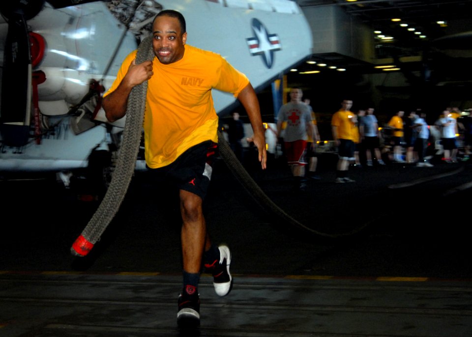 US Navy 110809-N-SG869-017 Machinery Repairman 2nd Class Reginald Warren, from Nashville, Tenn., hauls a mooring line during a physical training se