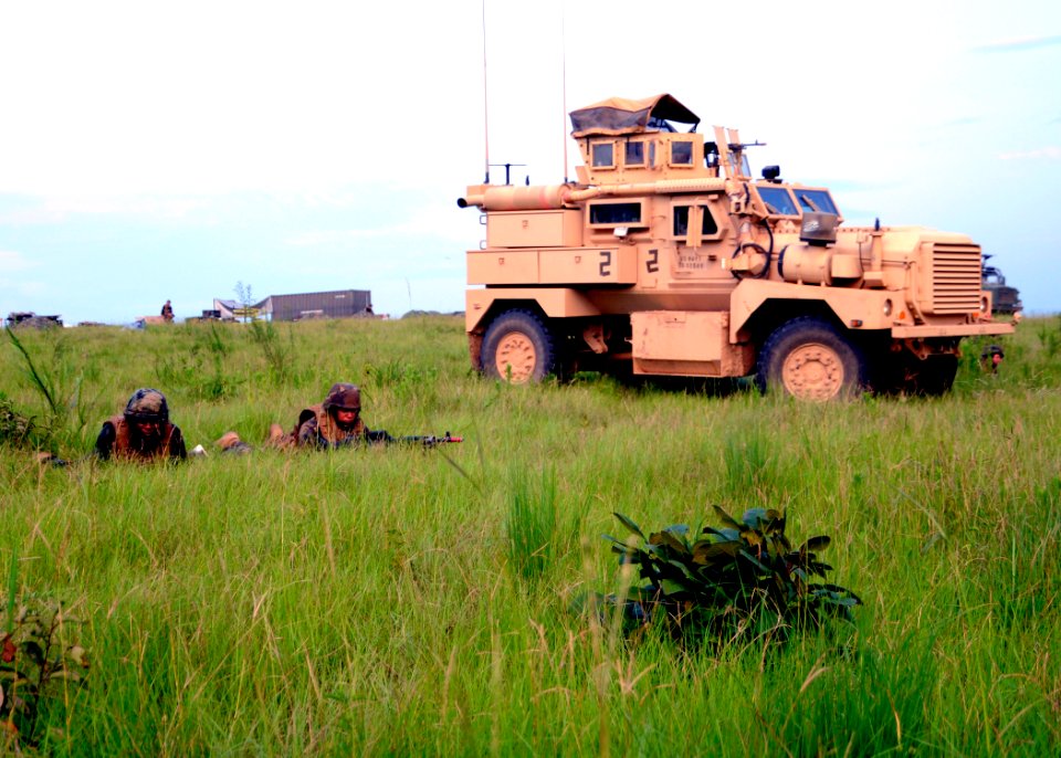 US Navy 110807-N-SD610-003 Seabees assigned to Naval Mobile Construction Battalion (NMCB) 7 stand defensive security in anticipation of an aggresso