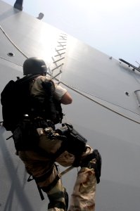 US Navy 110820-N-QL471-154 Lt. j.g. Patrick Nolan, a member of the visit, board, search and seizure team aboard the guided-missile destroyer USS T photo
