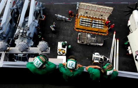 US Navy 110806-N-OI955-588 Sailors observe ordnance handling on the flight deck aboard USS John C. Stennis (CVN 74)
