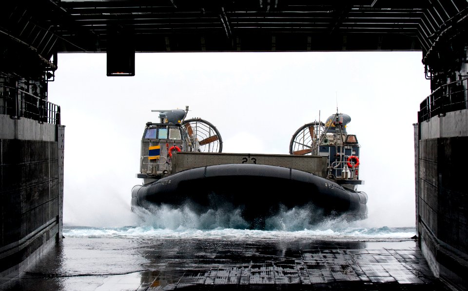 US Navy 110810-N-PB383-365 A landing craft air cushion approaches the well deck of USS New Orleans (LPD 18)