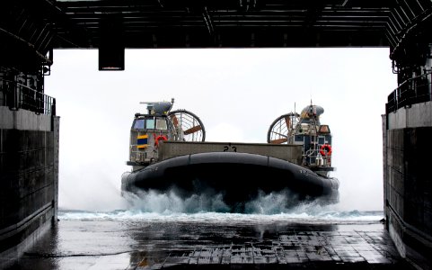 US Navy 110810-N-PB383-365 A landing craft air cushion approaches the well deck of USS New Orleans (LPD 18)