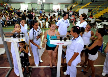 US Navy 110810-N-NY820-212 Patients are weighed by Costa Rican nurses during a community service medical event at the Barranca Municipal Gym medica photo