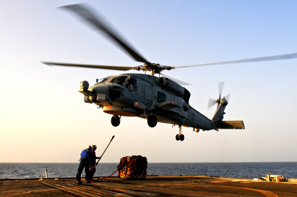 US Navy 110811-N-YM590-071 Sailors connect a cargo pendant to an SH-608