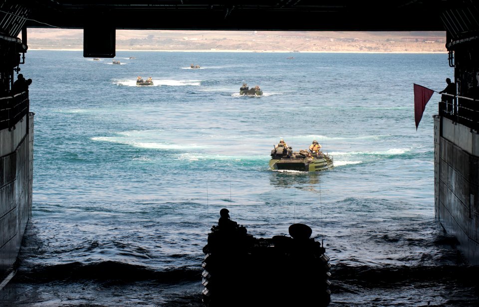 US Navy 110810-N-PB383-359 Amphibious assault vehicles enter the well deck of the San Antonio-class amphibious transport dock ship USS New Orleans