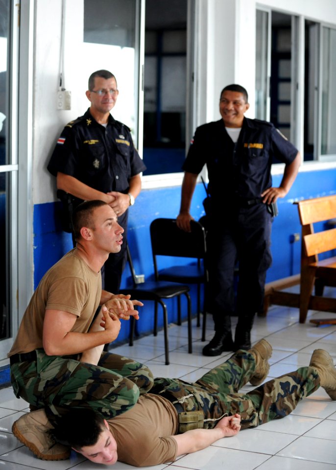 US Navy 110809-N-NY820-239 Master-at-Arms 3rd Class Adolfo Ruiz-Rodriguez, left, and Master-at-Arms 2nd Class Taylor Blackman participate in a subj