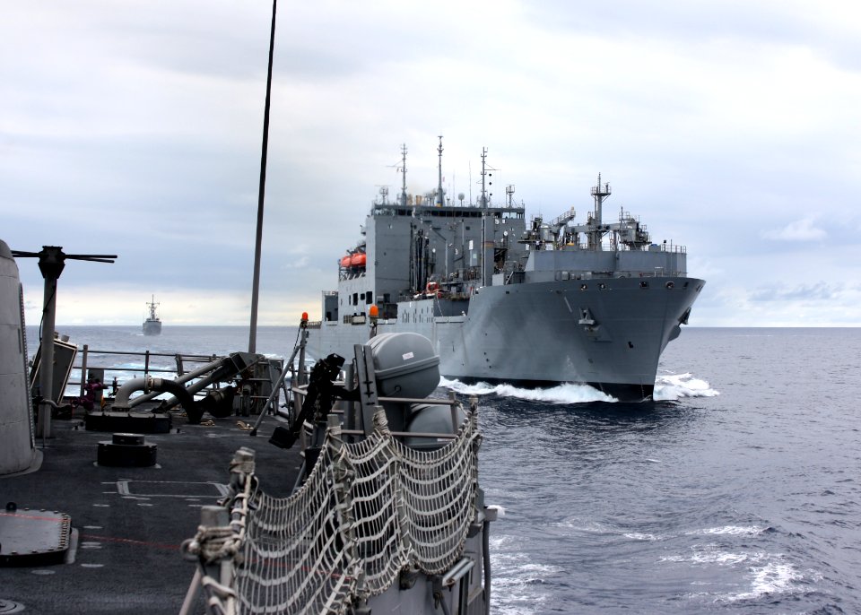 US Navy 110809-N-ZI300-035 The guided-missile frigate USS Thach (FFG 43) maneuvers away from the Military Sealift Command dry cargo and ammunition