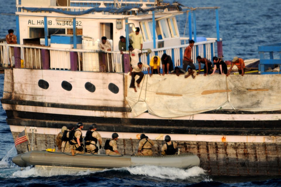 US Navy 110813-N-XQ375-279 A visit, board, search and seizure team from the USS Mitscher pull alongside a cargo vessel