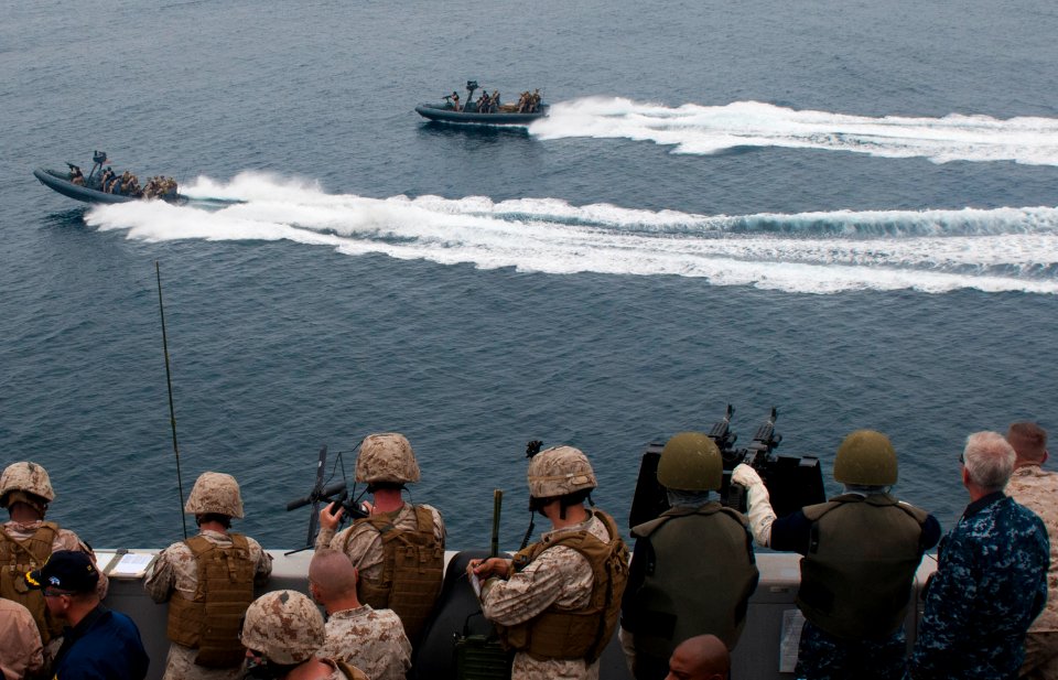 US Navy 110814-N-PB383-001 Sailors and Marines aboard the San Antonio-class amphibious transport dock ship USS New Orleans (LPD 18) observe Sailors