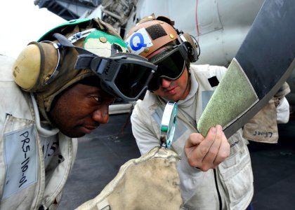 US Navy 110811-N-DS193-008 Aviation Machinist's Mate 1st Class Phillip Carlton, left, and Aviation Electronics Technician 1st Class Corey Clime use