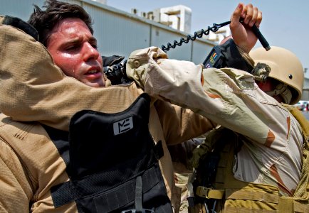 US Navy 110810-N-OT964-111 Sailors puts on a bomb suit during an emergency response training