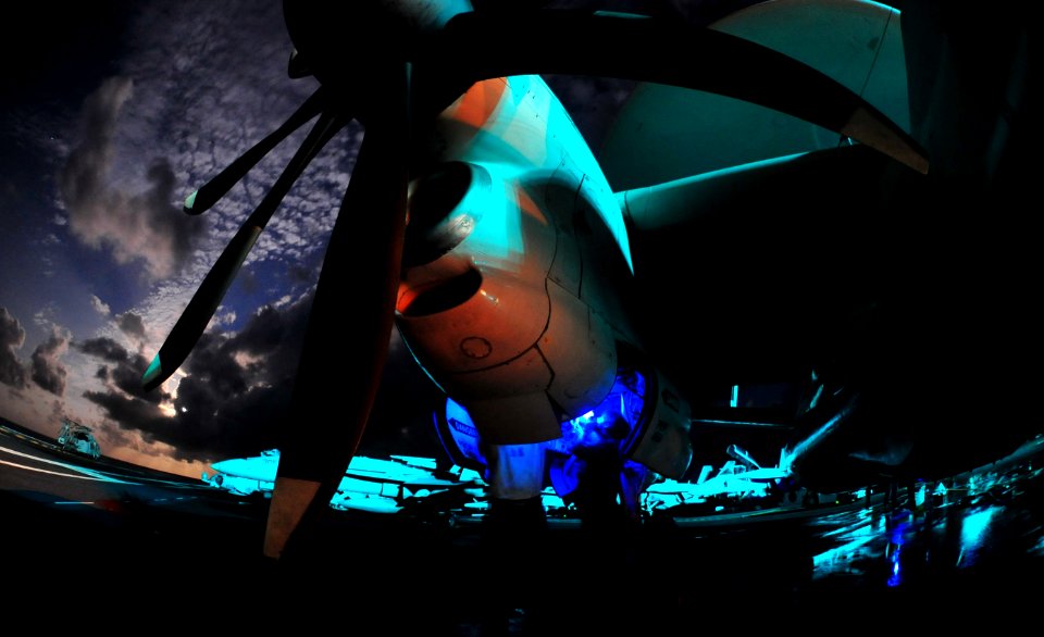 US Navy 110811-N-GC412-406 Sailors conduct routine maintenance on an E-2C Hawkeye aircraft assigned to the Providers of Fleet Logistics Combat Supp
