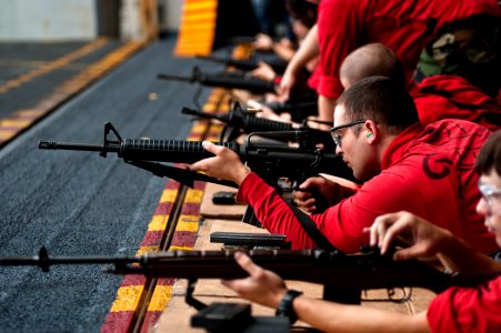 US Navy 110812-N-BT887-152 Sailors fire M-16A2 assault rifles during a weapons qualification aboard the Nimitz-class aircraft carrier USS John C. S