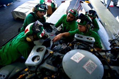 US Navy 110812-N-BT887-362 Sailors perform maintenance on an MH-60S Sea Hawk helicopter