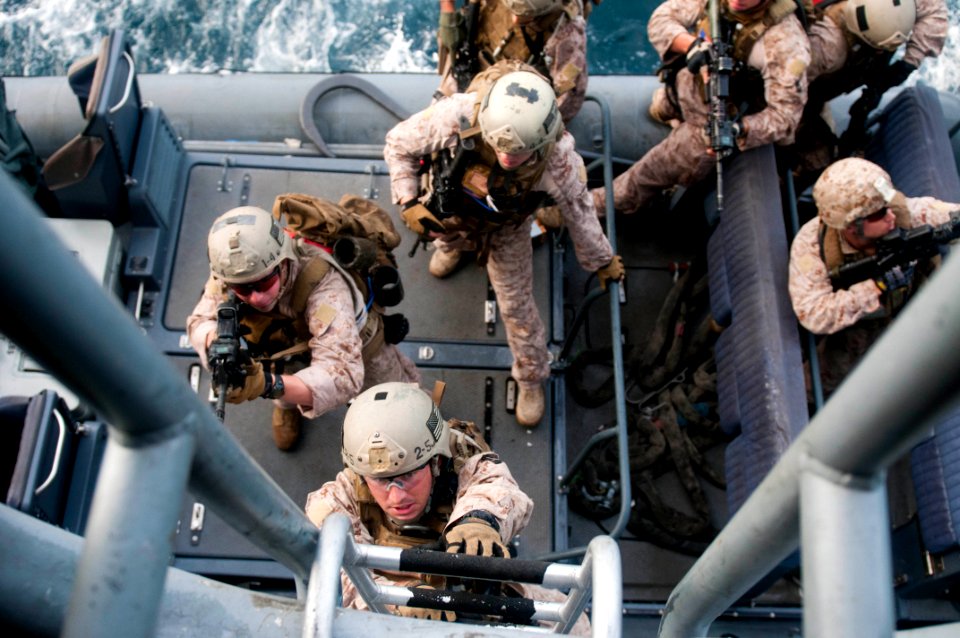 US Navy 110812-N-PB383-001 Marines disembark a rigid-hull inflatable boat operated by Sailors assigned to USS New Orleans (LPD 18) during a practic