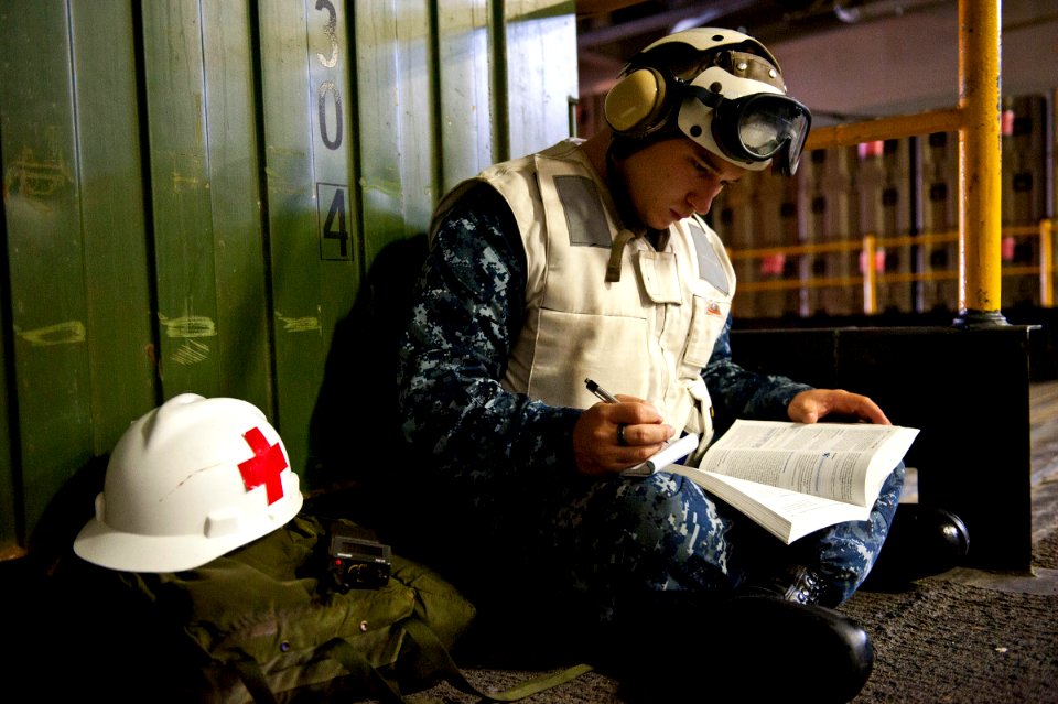 US Navy 110815-N-DX615-014 Hospital Corpsman 3rd Class Charles Carroll, from St. Clair Shores, Mich., studies in-rate material for the upcoming Nav