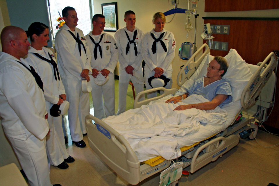 US Navy 110815-N-ZL585-042 Sailors assigned to the Navy Operational Support Center, Indianapolis, visit a patient at the Roudebush VA Medical Cente
