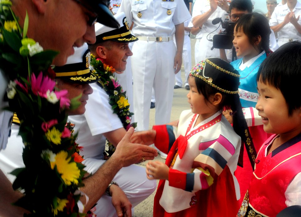 US Navy 110813-N-XG305-273 Capt. Charles Williams, U.S. 7th Fleet Chief of Staff, is greeted by Korean children
