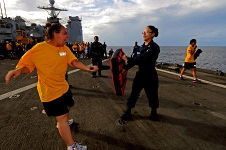 US Navy 110819-N-RC734-288 Quartermaster Seaman Michaela McCracken fights off a simulated attacker after being sprayed with pepper-spray