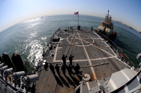 US Navy 110813-N-QL471-068 Sailors salute the national ensign